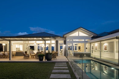 This is an example of a beach style courtyard rectangular pool in Sydney.