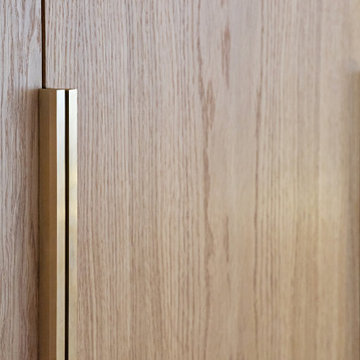 High-end oak joinery with brass handles in Belgravia apartment
