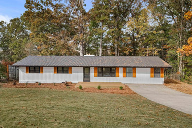 Example of a mid-sized exterior home design in Other