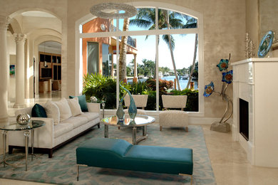 Inspiration for a mid-sized transitional open concept marble floor living room remodel in Miami with beige walls, a standard fireplace and a stone fireplace