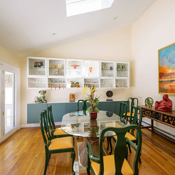 Light filled dining area filled with world wide collectables