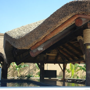 Thatch & timber is the is the focal point of this beautifully landscaped garden