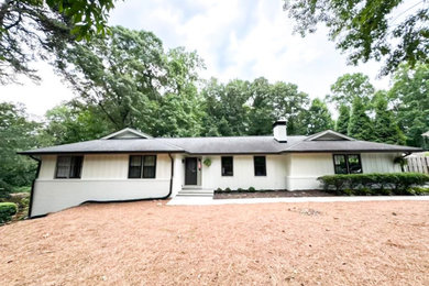 Mid-sized traditional white one-story wood and board and batten exterior home idea in Atlanta