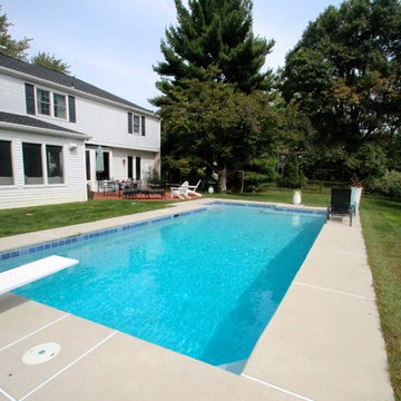 Classic Rectangle style in-ground salt water pool with diving board