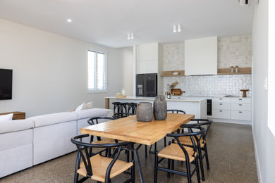 This is an example of a contemporary dining room in Townsville.