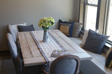 Inspiration for a mid-sized timeless laminate floor and gray floor kitchen/dining room combo remodel in Other with gray walls
