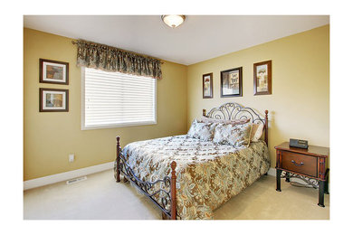 Foto de habitación de invitados clásica de tamaño medio con paredes beige