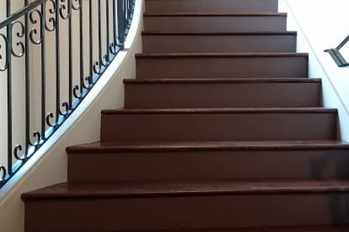 Large elegant wooden straight staircase photo in Miami with wooden risers