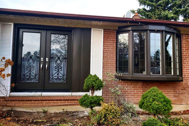 Example of an exterior home design in Toronto