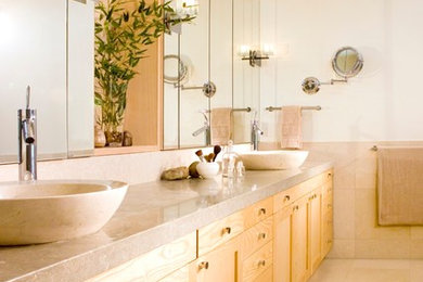 This is an example of a large modern master bathroom in San Francisco with shaker cabinets, light wood cabinets, a two-piece toilet, beige tile, ceramic tile, beige walls, ceramic floors, a vessel sink and quartzite benchtops.