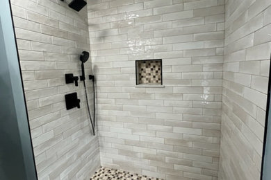 Mid-sized trendy master ceramic tile, beige floor and single-sink bathroom photo in Philadelphia with furniture-like cabinets, brown cabinets, a two-piece toilet, green walls, quartz countertops, white countertops and a freestanding vanity