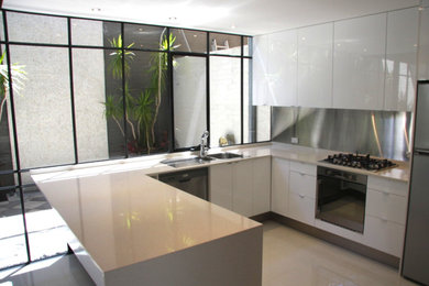 Inspiration for a large modern kitchen in Perth with porcelain floors.
