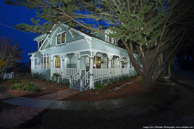 Inspiration for a mid-sized timeless green two-story wood exterior home remodel in San Francisco