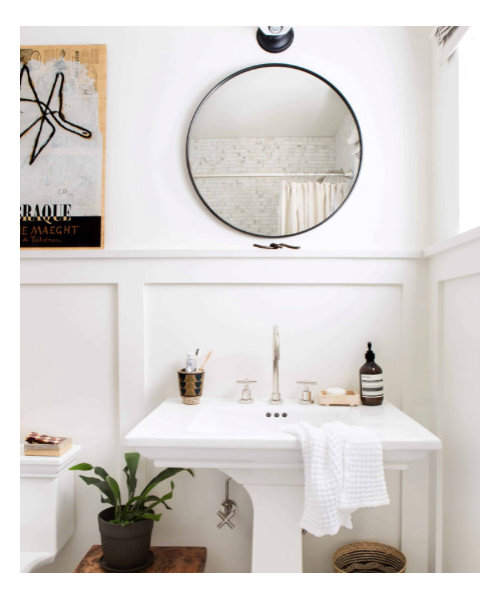 Single light over round mirror