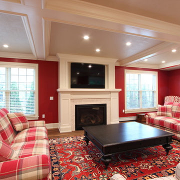 TV Above Gas Fireplace with Marble Tile Surround in Red Family Room