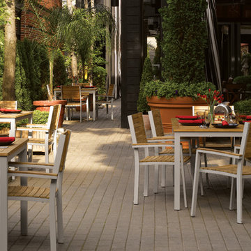 Travira Dining Set in Teak on Patio