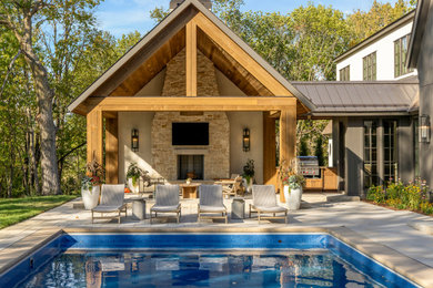 Large french country white two-story stone exterior home idea in Minneapolis with a shingle roof and a brown roof