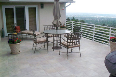 Example of a mid-sized classic beige two-story stucco exterior home design in Salt Lake City with a shingle roof