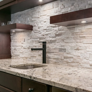 This is an example of a large classic look-out basement in Minneapolis with grey walls, dark hardwood flooring, a corner fireplace, a tiled fireplace surround and brown floors.