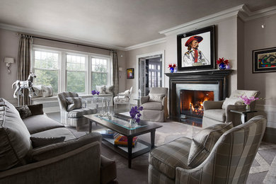 Example of a large classic formal and enclosed dark wood floor, brown floor and tray ceiling living room design in Chicago with gray walls, a standard fireplace, a concrete fireplace and no tv