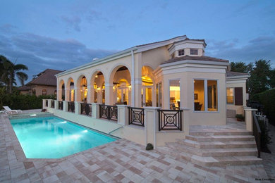 Pool - transitional backyard rectangular lap pool idea in Miami