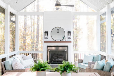 Mid-sized mountain style tile back porch photo in Raleigh with a roof extension
