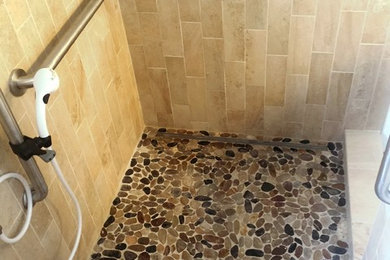 Inspiration for a multicolored tile and pebble tile pebble tile floor corner shower remodel in Other