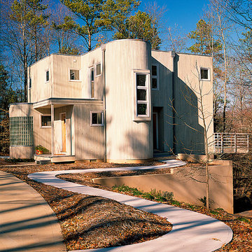 Vertical Cedar curves around the Stair tower to create a dynamic entry sequence