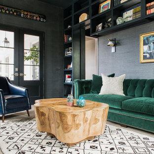 Inspiration for a transitional enclosed light wood floor family room remodel in Charleston with black walls