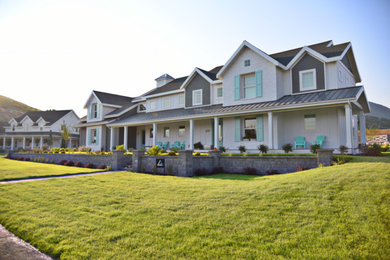 Large farmhouse white two-story mixed siding exterior home photo in Salt Lake City with a mixed material roof