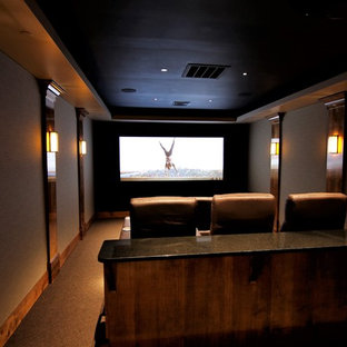 Home theater - mid-sized modern enclosed carpeted and brown floor home theater idea in Baltimore with beige walls and a projector screen
