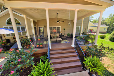 Mid-sized elegant back porch photo in Richmond with decking and a roof extension