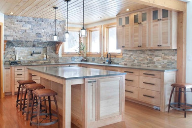 Large arts and crafts l-shaped kitchen photo in Burlington with light wood cabinets and two islands