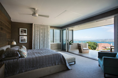 Inspiration for a large contemporary master bedroom in Sydney with multi-coloured walls and carpet.
