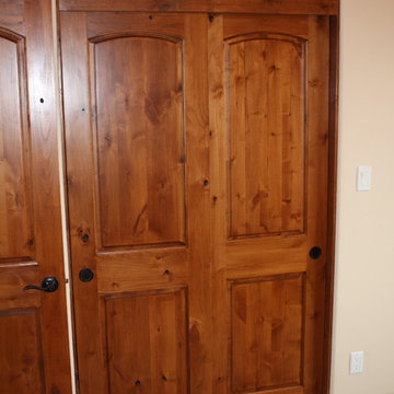 Knotty Alder Bi-Pass Doors 2-Panel Arch