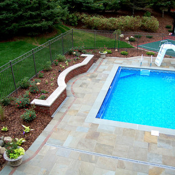 Bluestone pool decks, arbors, fireplaces, outdoor kitchen & pavilion