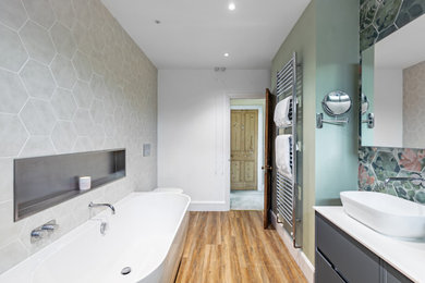 Photo of a medium sized modern family bathroom in Gloucestershire with grey cabinets, double sinks and a floating vanity unit.