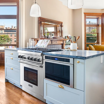 Colossal cabinets and an island are dialed back for a seamless flow (SWEETEN)