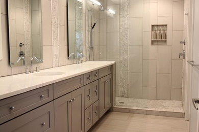 Alcove shower - mid-sized contemporary master ceramic tile, beige tile and gray tile ceramic tile alcove shower idea in Other with quartzite countertops, shaker cabinets, gray cabinets, an undermount sink and gray walls