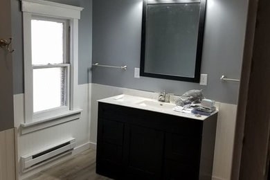 Inspiration for a medium sized classic bathroom in Chicago with freestanding cabinets, black cabinets, white tiles, a one-piece toilet, an alcove bath, a shower/bath combination, blue walls and a shower curtain.