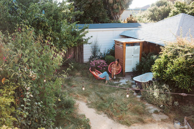 Photo of a small modern drought-tolerant and partial sun backyard decomposed granite vegetable garden landscape in San Francisco for spring.