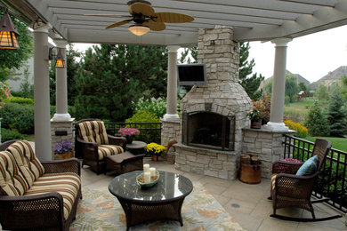 Large contemporary backyard patio in Chicago with a fire feature, concrete pavers and a pergola.