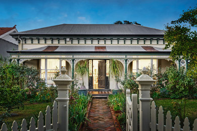 This is an example of a traditional house exterior in Melbourne with a metal roof.