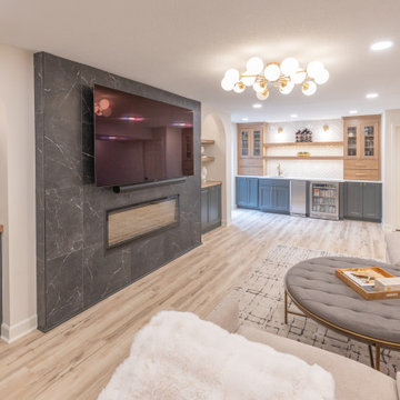 Warm & Inviting Basement Retreat with Custom Bar + Entertainment Center
