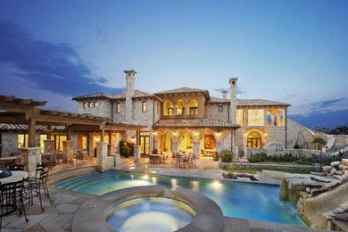 Tuscan home design photo in Austin