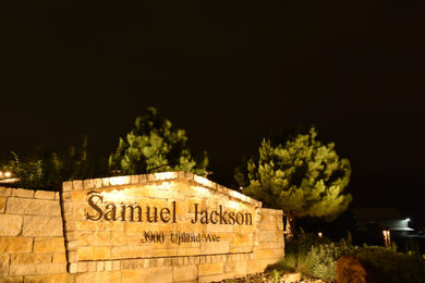 Photo of a large drought-tolerant, desert and full sun side yard river rock landscaping for summer.