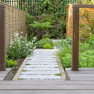 Raised decking area in this Sanctuary Garden Design in London