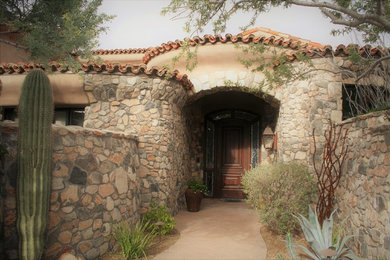 Tuscan home design photo in Phoenix