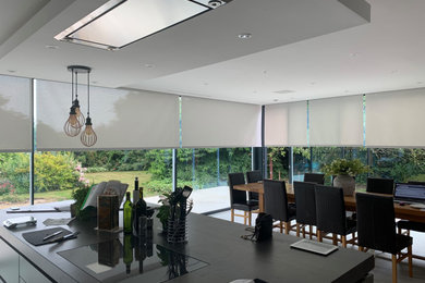 Photo of a modern eat-in kitchen in Hampshire with with island.