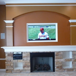Custom Fireplace Mantle with Wide Screen TV - Indoor Fireplaces